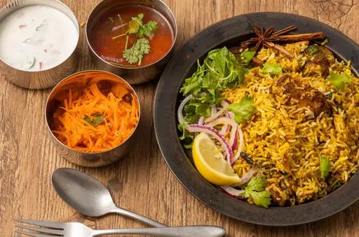 Hyderabadi biryani pot being opened